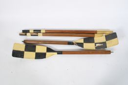 A pair of mid-20th century, wooden rowing oars.