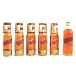 Six bottles of Johnnie Walker whisky.