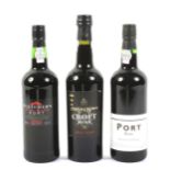 Three bottles of assorted Port.