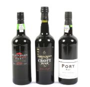 Three bottles of assorted Port.