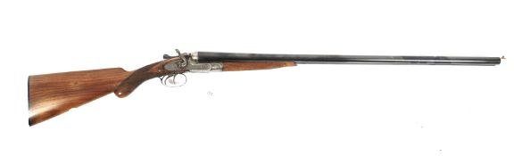 A G & J Peck 12 gauge side by side hammer action shotgun. 30 inch barrels. 2 1/2 inch chambers.