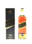 A boxed bottle of Johnnie Walker Black label twelve year old whisky.