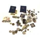 A collection of coins and bank notes.