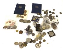 A collection of coins and bank notes.