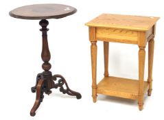 A 20th century mahogany wine table and light oak side table.