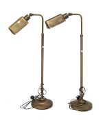 Two contemporary adjustable Olt-lite floor lamps.