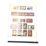 A collection of contemporary Franklin Mint stamps.