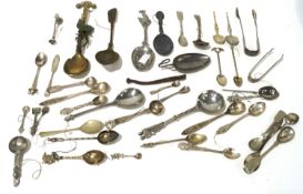 An assortment of silver and silver plated spoons.