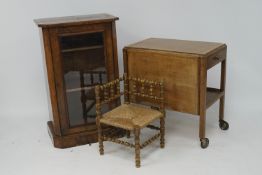 A burr walnut cabinet, butlers trolley and a small corner chair.