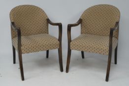 A pair of tub chairs.