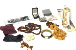 A box of assorted costume jewellery. Including beaded necklaces, earrings, pendant, etc.