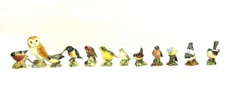 Twelve Beswick ceramic birds.