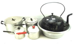A collection of vintage pots and pans.