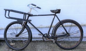 A vintage butcher's bicycle in black.