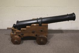 A contemporary wooden replica of a cannon.