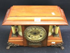 An Edwardian Seth Thomas mantel clock.