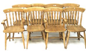 A set of eight wooden kitchen chairs including two carvers.