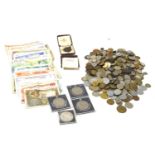 A collection of GB and world coins and bank notes.