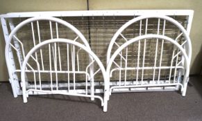 Two white metal single beds. With domed bed ends, unassembled, D91.