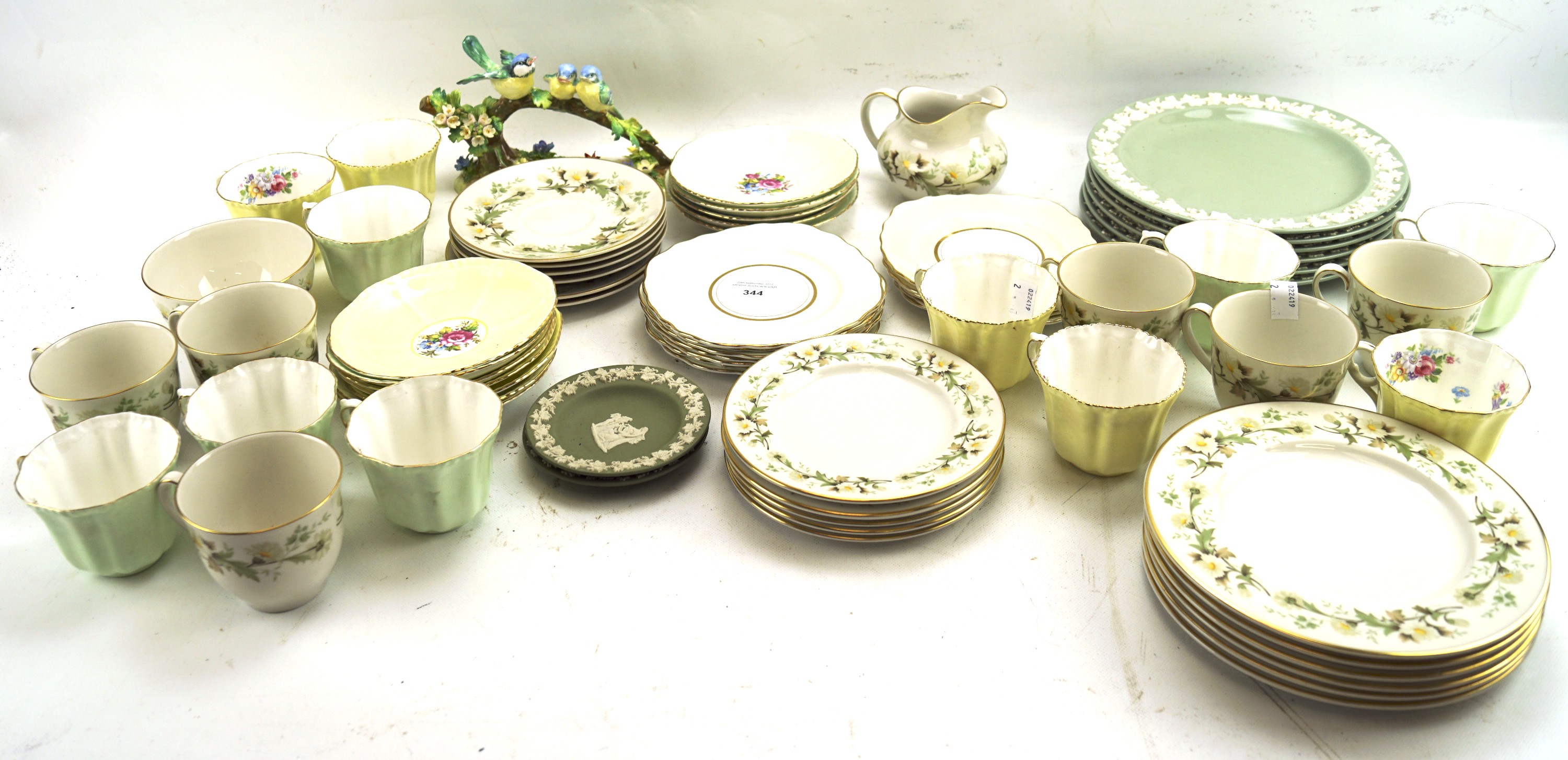 A Royal Doulton part tea service and an assortment of teacups and saucers.