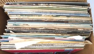 Assorted vinyl LP records.