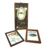 A Guiness wall clock and two advertising mirrors.