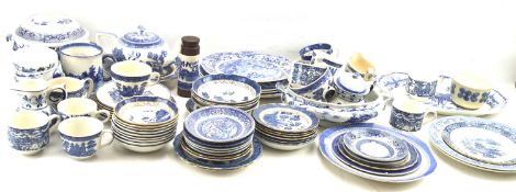 A large assortment of blue and white kitchen ceramics.