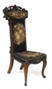 A Victorian rosewood nursing chair.