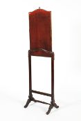 A Victorian stained pine rising fire screen.