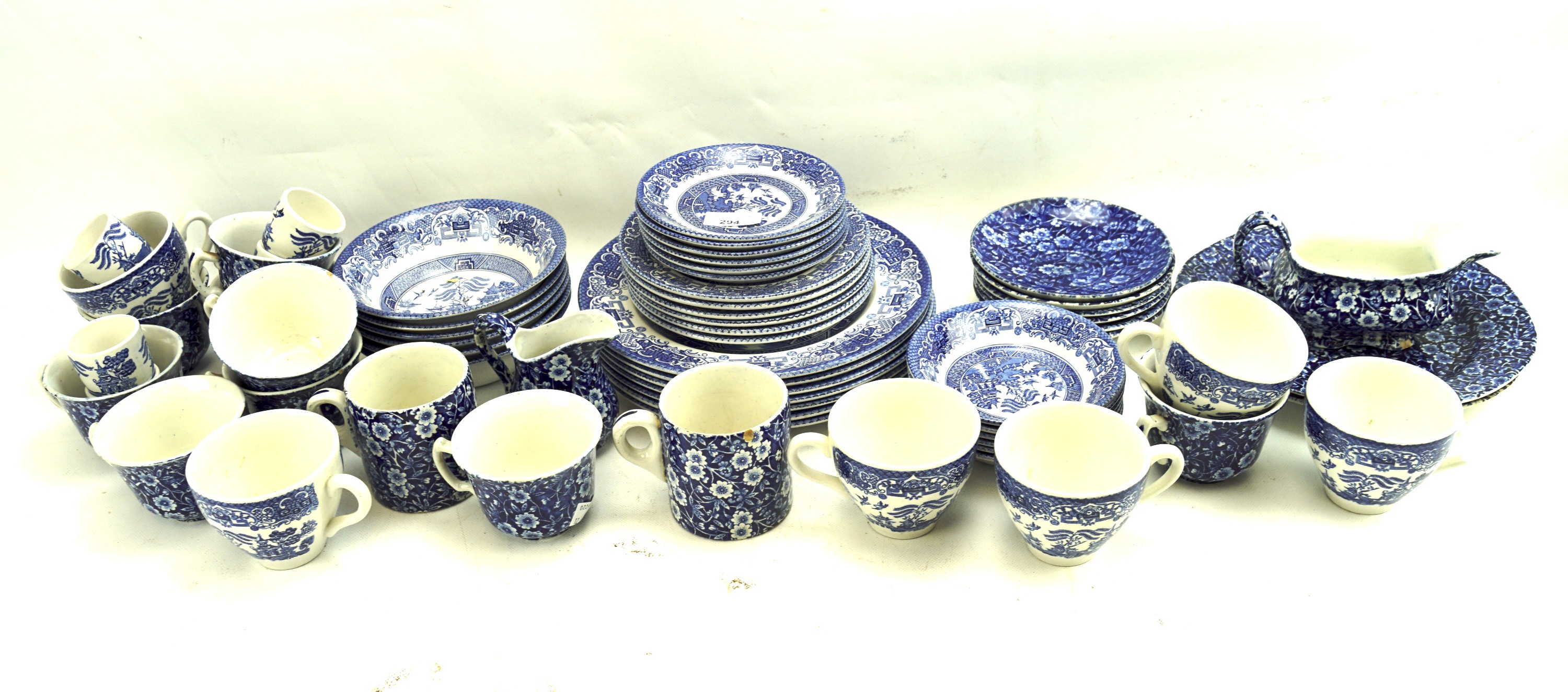 Two part tea services in blue and white.