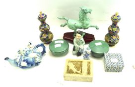 A group of Asian ceramics and collectables.