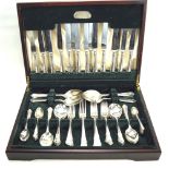 An eight setting canteen of cutlery. With fitted case. L45.