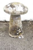 A large staddle stone with domed top resting on a splayed pillar. Circa H75cm.