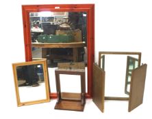 Four modern mirrors. Including a folding three part example, a large wood framed example, etc.