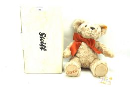 A contemporary Steiff teddy bear.