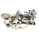 A collection of silver plated and metal kitchen items. Including teapots, fruit bowl, dishes, etc.