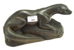 A resin sculpture of an otter.
