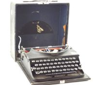 A portable 1920s typewriter.