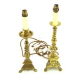 Two brass candlesticks.