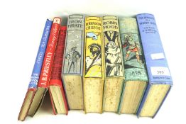 A group of vintage hard backed books. Including Robinson Crusoe, Robin Hood, etc.