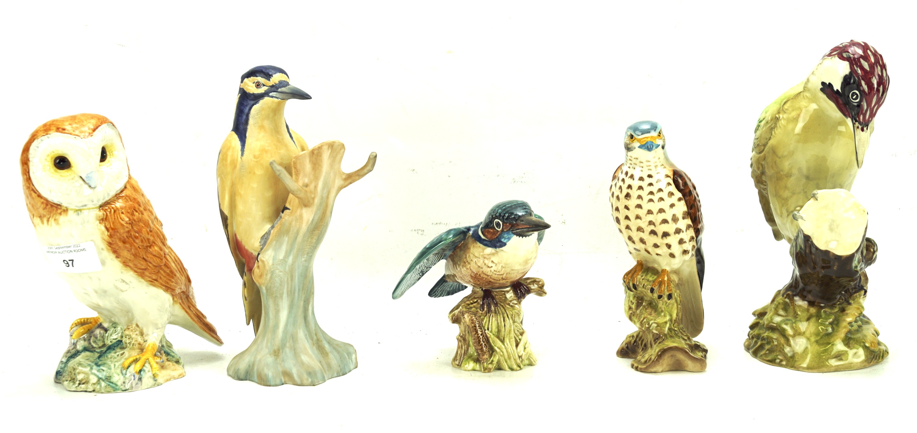 Four Beswick birds and a ceramic owl.