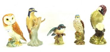 Four Beswick birds and a ceramic owl.