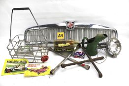 Assorted car parts and collectables. Including an MG grill, a Corona bottle crate, head lamp, etc.