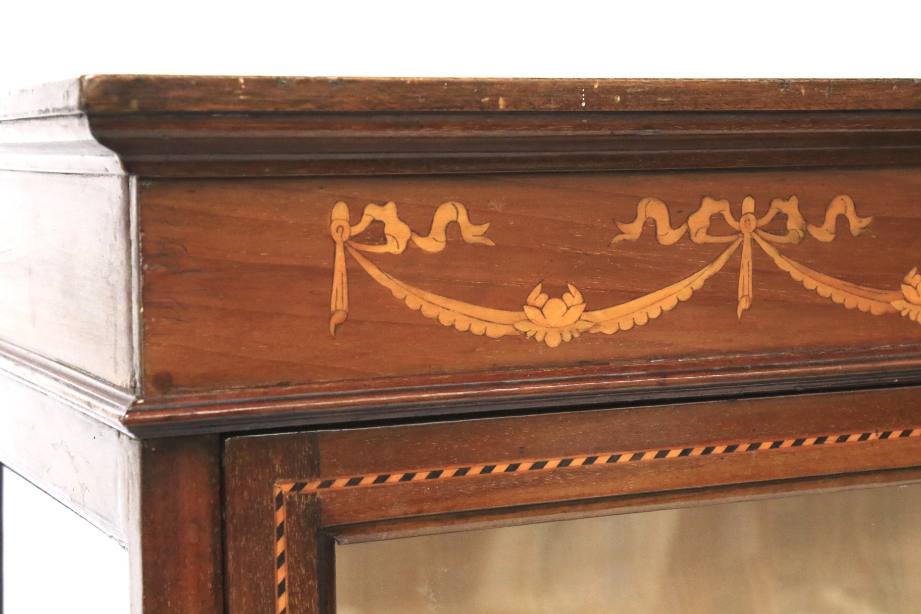 A mahogany glazed cabinet with inlaid decoration. Raised on slender square supports. - Image 2 of 2