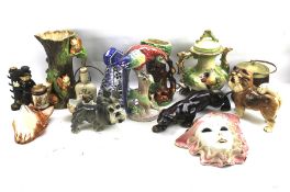 A large assortment of ceramics. Including figures of animals, teapot, vases, a wall plaque, etc.
