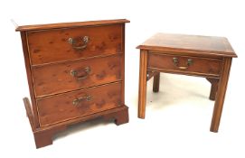 A contemporary small veneered chest of drawers and a side table.