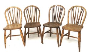 A set of four elm Windsor kitchen chairs.