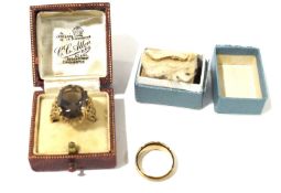 Three 9ct gold rings. Comprising an engraved band, J, 1.2g, a moulded band 1.