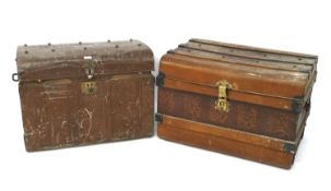Two metal travelling trunks.
