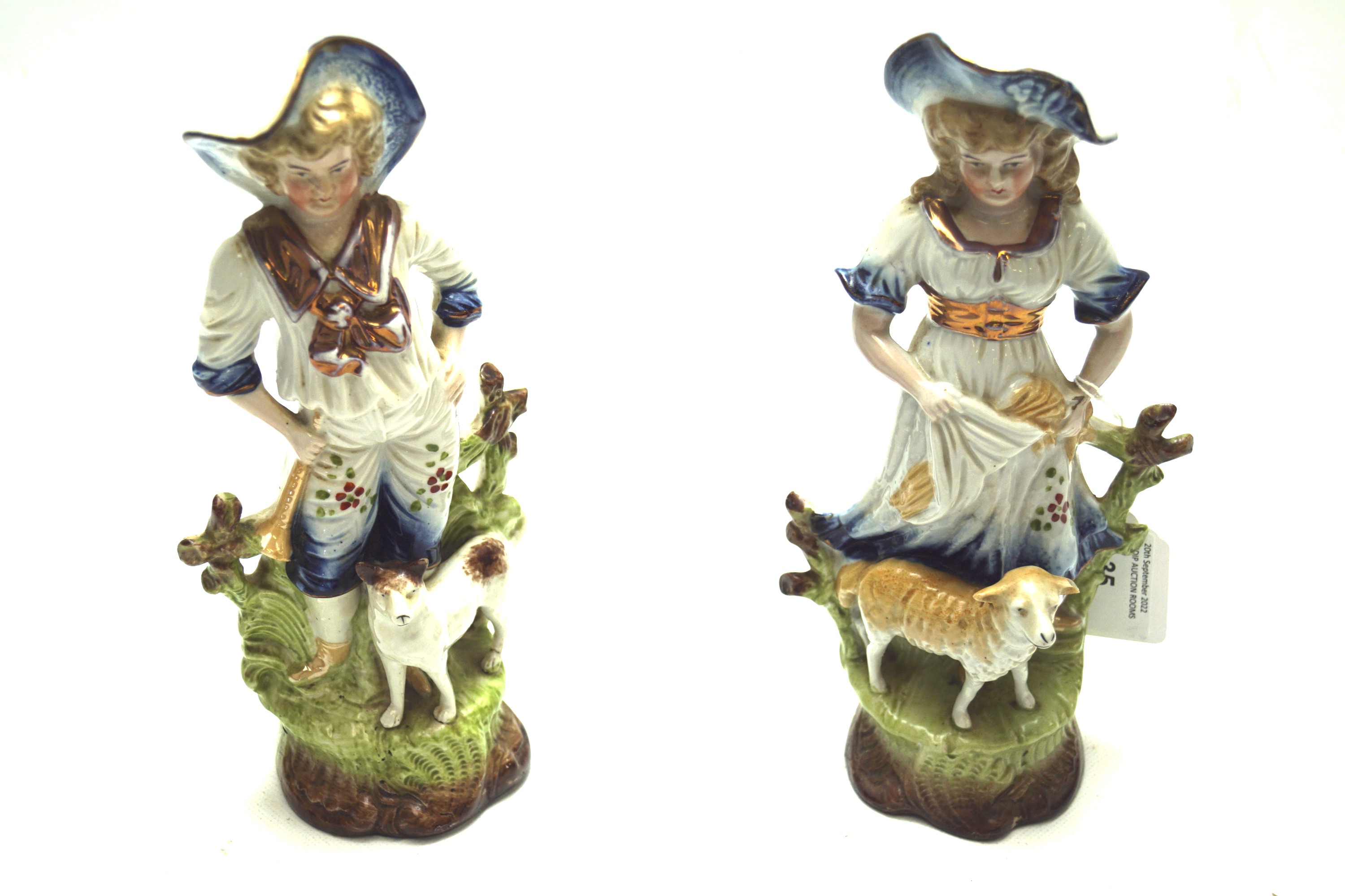 Ceramic shepherd and shepherdess figures.